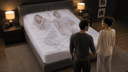 Couple assessing a king mattress with a transparent overlay showing the same couple uncomfortable in different sleeping positions.